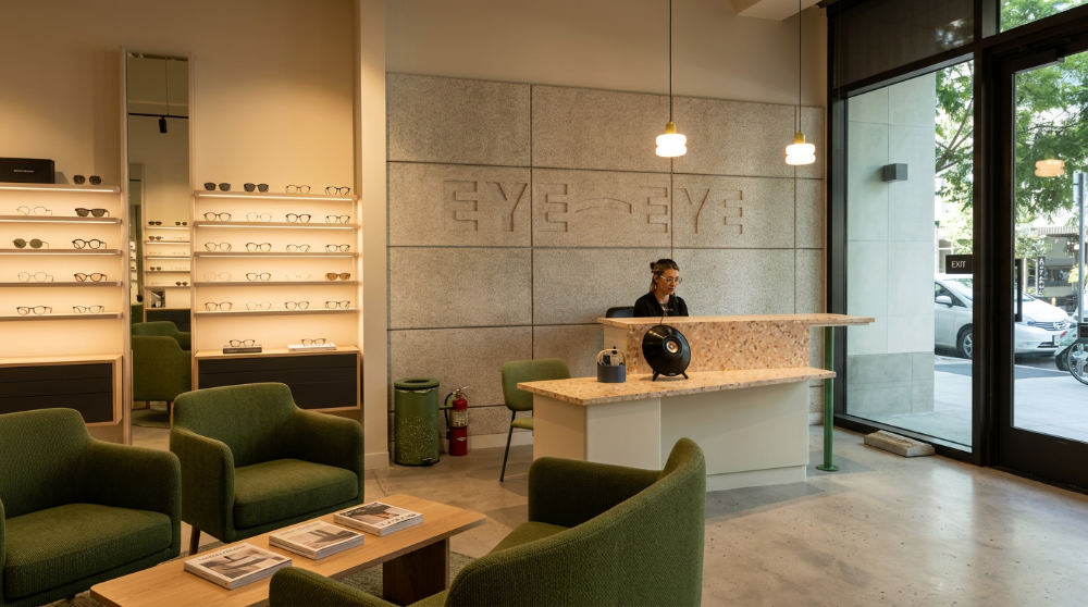 Eye doctor office interior in Bankers Hill featuring designer eyewear displays on shelves.